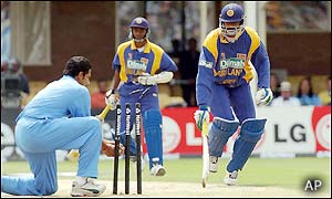 Russell Arnold is run out for 13 after a mix up with Upul Chandana