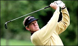 Scotland's Colin Montgomerie goes four under par to move up the leaderboard and into contention for the title