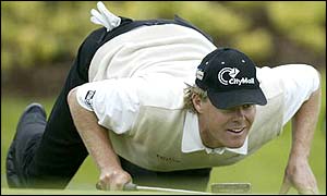 Joakim Haeggman lines up his putt and has his eyes on the title as he moves into contention on four under par