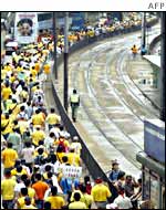 Crowds of protesters march through Hong Kong