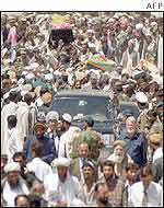 Mourners march in Kabul with Qadir's coffin which was then flown to Jalalabad