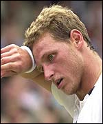 David Nalbandian mops his brow during his defeat against Lleyton Hewitt