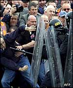 Protestors held back by police