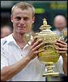 Lleyton Hewitt holds the men's singles trophy at Wimbledon