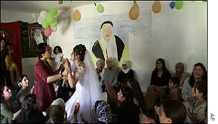 Bride being persuaded to dance