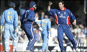 Ronnie Irani celebrates after taking a catch which sees Ashish Nehra dismissed
