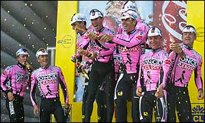 ONCE-Eroski riders take to the podium to celebrate their team win in the time trial on stage four 