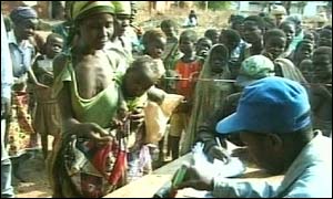 Malawians queue for food