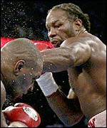 Lennox Lewis lands a punch on Mike Tyson
