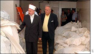 Bosnian Muslim officials inspect body bags at the Visoko identification centre 