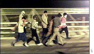 Refugees try to enter the Tunnel