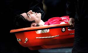 Robert Pires is stretchered off after suffering cruciate ligament damage