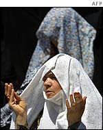 Iranian woman performs Friday prayers at Imam Khomeini square in Isfahan