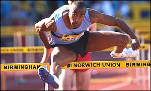 Colin Jackson clears a hurdle in Birmingham