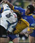 David Solomona is tackled by Jason Stevens