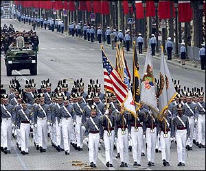 Squadron of cadets from elite US military academy Westpoint march down the Champs Elysees