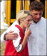 Janine Whitlock is comforted by her coach Brian Hooper on Sunday