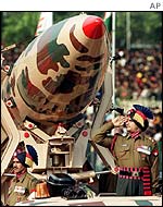 Indian soldier stands next to an Indian nuclear missile