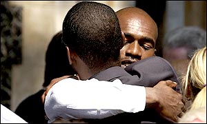 Chris Lewis and Alex Tudor embrace after the memorial service