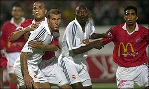 French star Zinedine Zidane is held during Real Madrid's match against Al Ahly