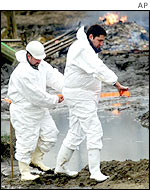 German workers decontaminate a farm