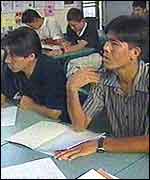 Afghan refugees in a class