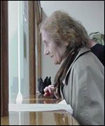 A woman at a counter in a Belgrade tax office
