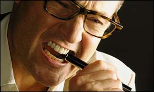 Frustrated man biting pen, BBC