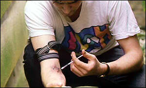 Heroin user injecting