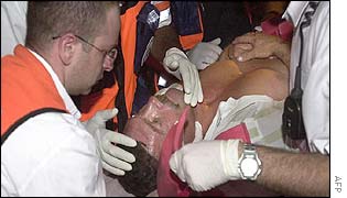 Injured man is aided by emergency workers