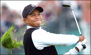 Tiger Woods swipes his shot at the first