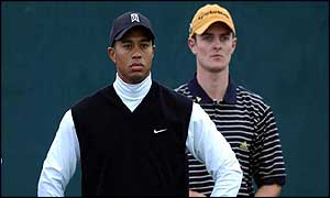 Tiger Woods and Justin Rose prepare to tee off from the first hole