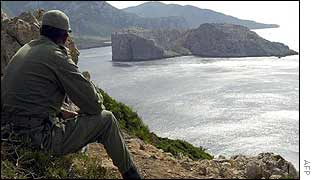 Moroccan soldier looks out to Perejil