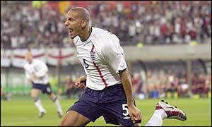 Rio Ferdinand celebrates scoring for England during the World Cup
