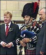Mr Kennedy, Lord Razzall and a piper
