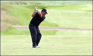 Peter O'Malley approaches the green at the 18th
