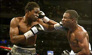 Vernon Forrest hits Shane Mosley with a left hook during their WBC welterweight title fight