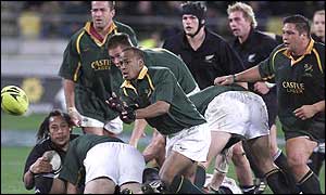 Springboks scrum-half Johannes Conradie fires out a pass during his side's defeat to New Zealand 