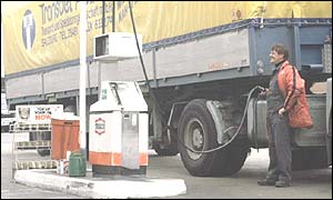 Lorry driver filling up