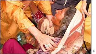 A mother whose daughter committed suicide after being raped is comforted