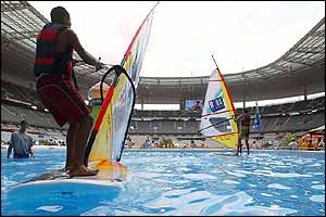 Windsurfers use a pool at a beach created at the Stade de France