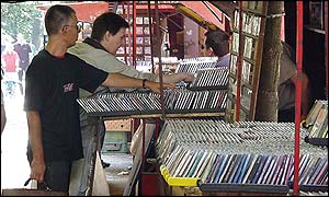 Shoppers at a Belgrade bootleg CD stall