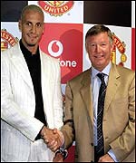Rio Ferdinand and Sir Alex Ferguson seal the deal with a handshake