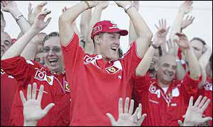Michael Schumacher celebrates his fifth world championship with the Ferrari mechanics