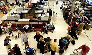 Passengers queuing at Heathrow Airport
