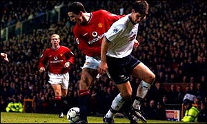 Manchester United's John O'Shea turns inside Derby County's Chris Riggott