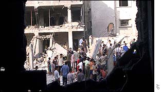 Civilians search the rubble of their houses in Gaza following the attack