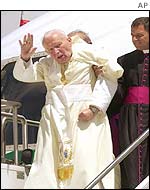 The Pope waves as he arrives in Toronto