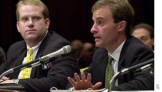 Jeffrey Dellapina, managing director of JPMorgan Chase Bank, testifies before a Senate subcommittee, along with vice president Robert Traband (left).