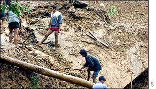 Rescue workers at the site of a landslide near Kathmandu